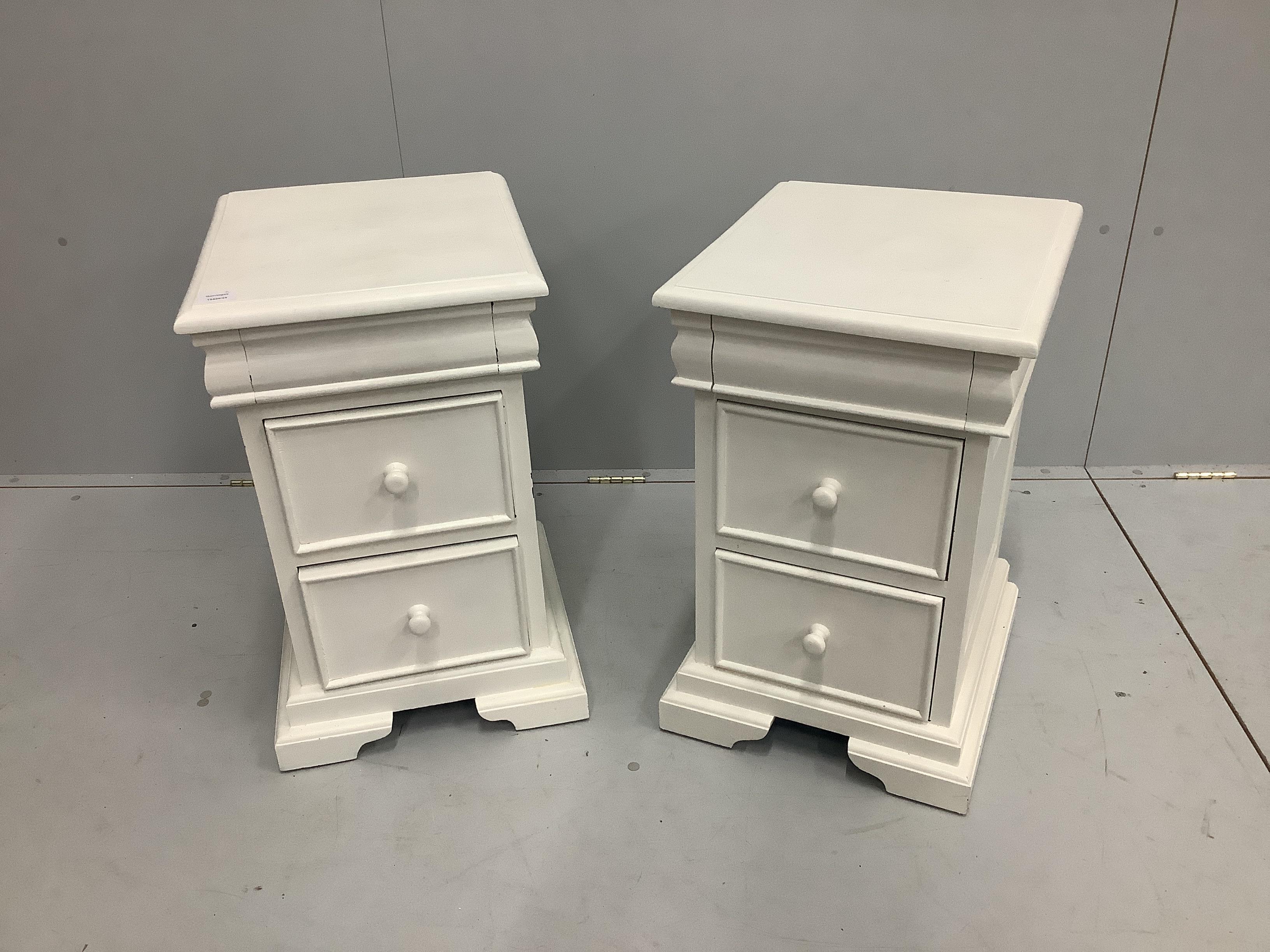 A pair of reproduction mahogany bedside chests, later painted, width 41cm, depth 44cm, height 64cm